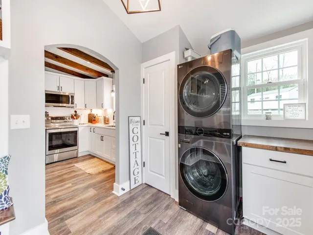 a view of a hallway with a stove top oven