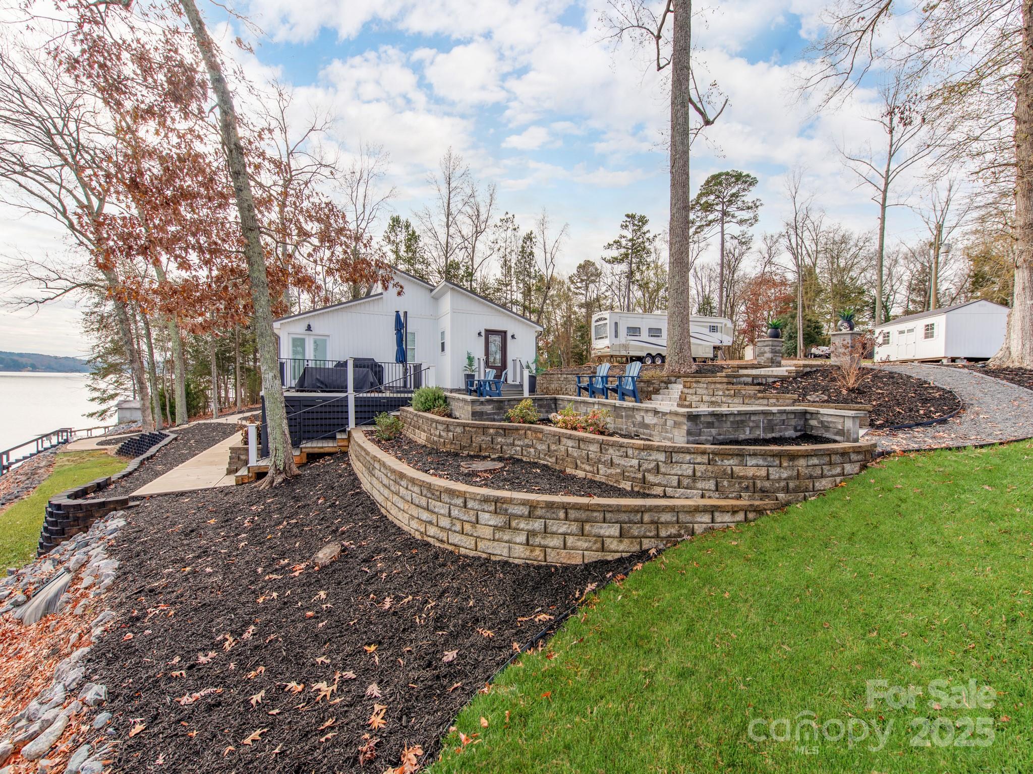 6788 Bucleigh Road Lake Wylie, SC 29710 - Photo 31 of 45 a view of a playground with a house