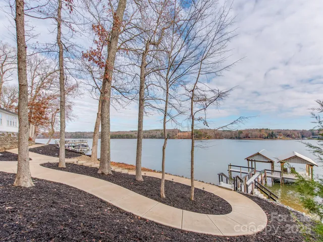 a view of a yard with swimming pool