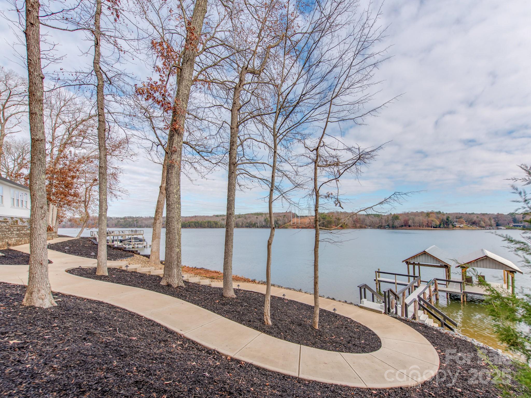6788 Bucleigh Road Lake Wylie, SC 29710 - Photo 34 of 45 a view of a lake with a large trees
