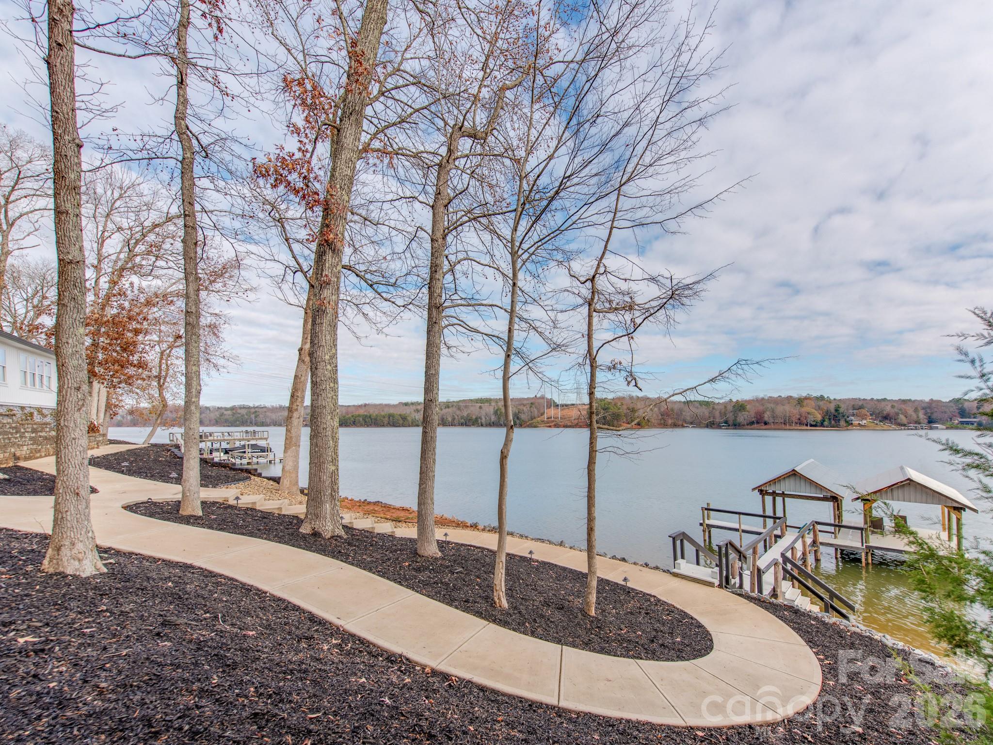 6788 Bucleigh Road Lake Wylie, SC 29710 - Photo 35 of 45 a view of a lake with a large trees