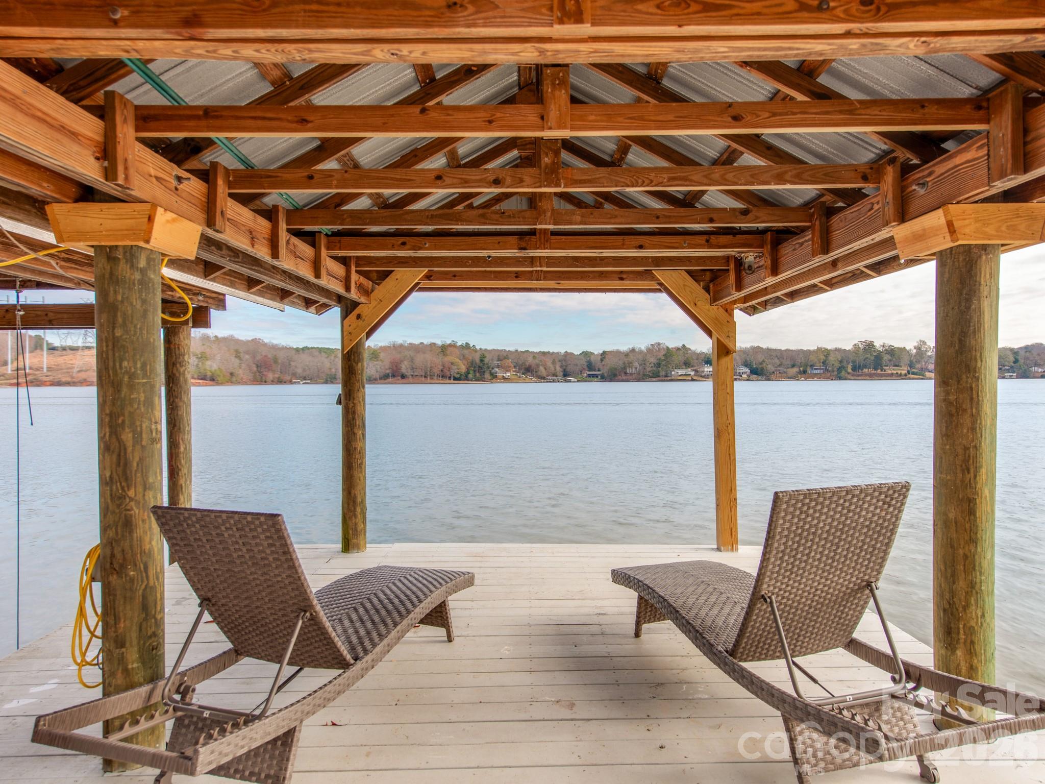 6788 Bucleigh Road Lake Wylie, SC 29710 - Photo 37 of 45 a view of a chair and table in the patio