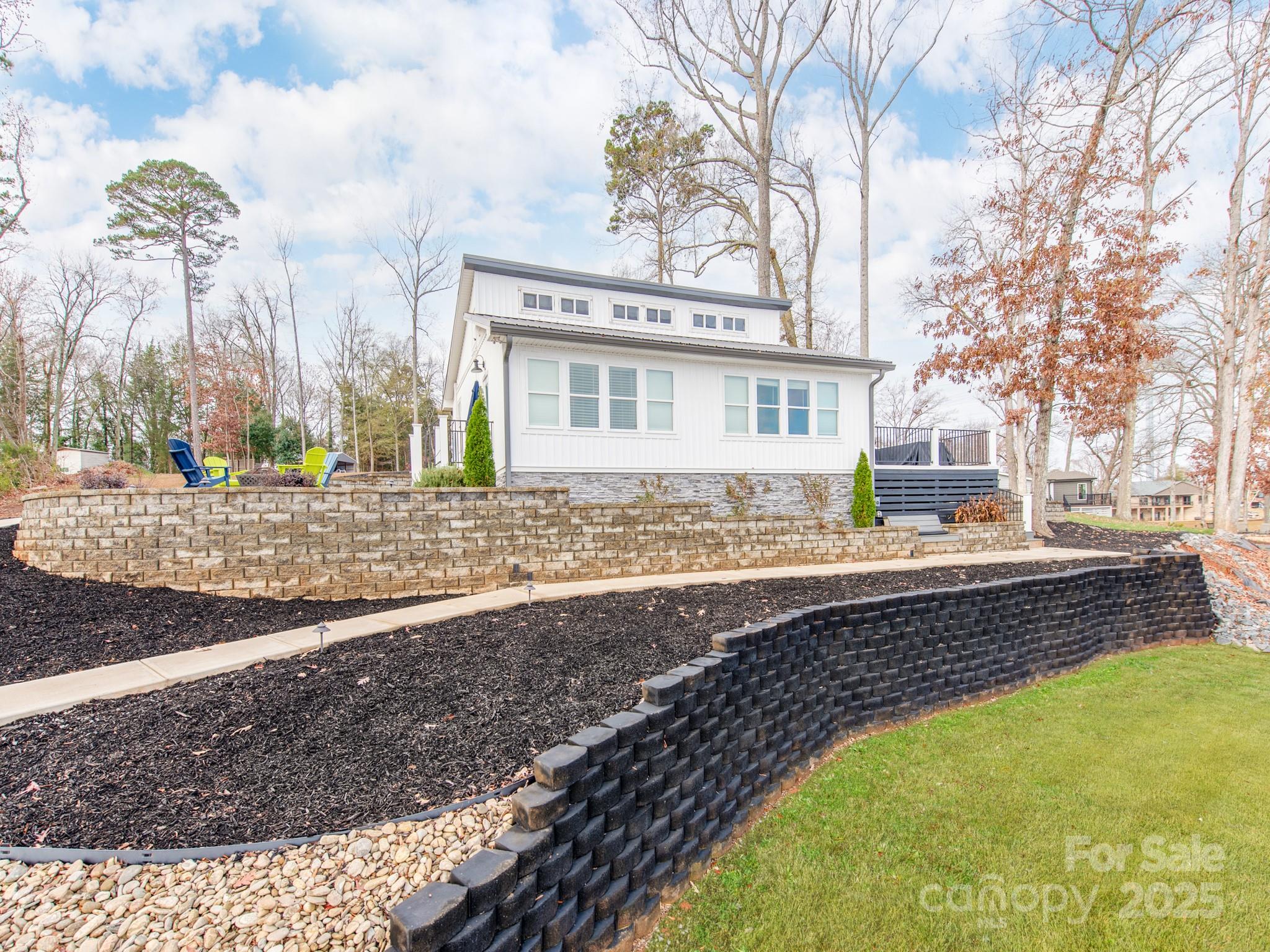 6788 Bucleigh Road Lake Wylie, SC 29710 - Photo 39 of 45 a view of a house with a swimming pool