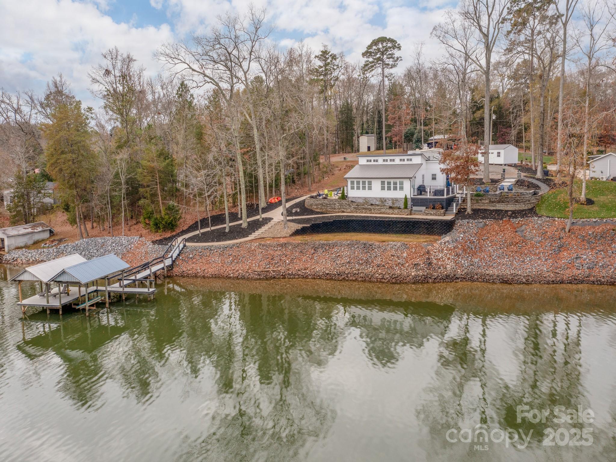 6788 Bucleigh Road Lake Wylie, SC 29710 - Photo 43 of 45 a view of a lake with houses