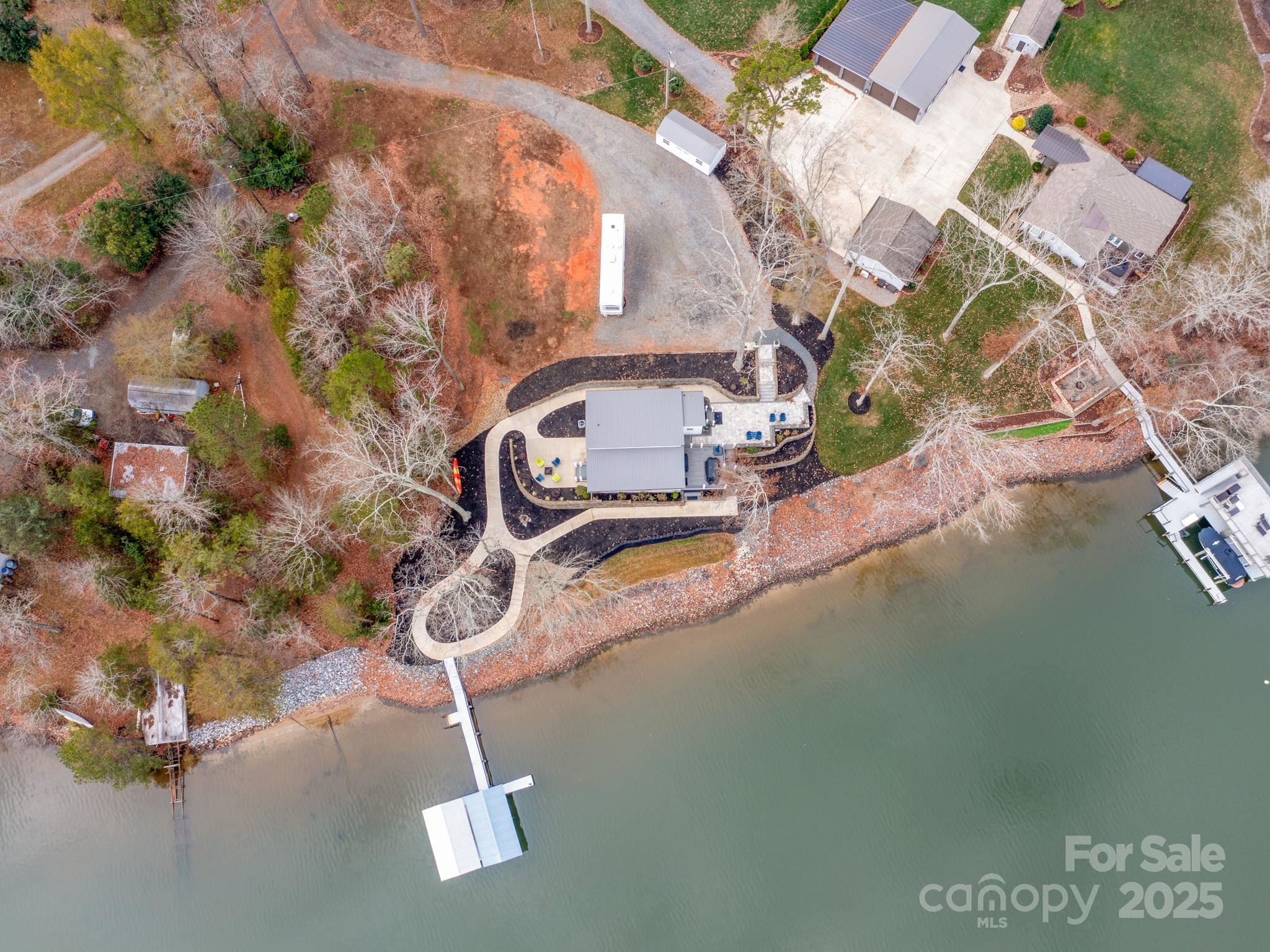 6788 Bucleigh Road Lake Wylie, SC 29710 - Photo 45 of 45 an aerial view of a swimming pool with a yard