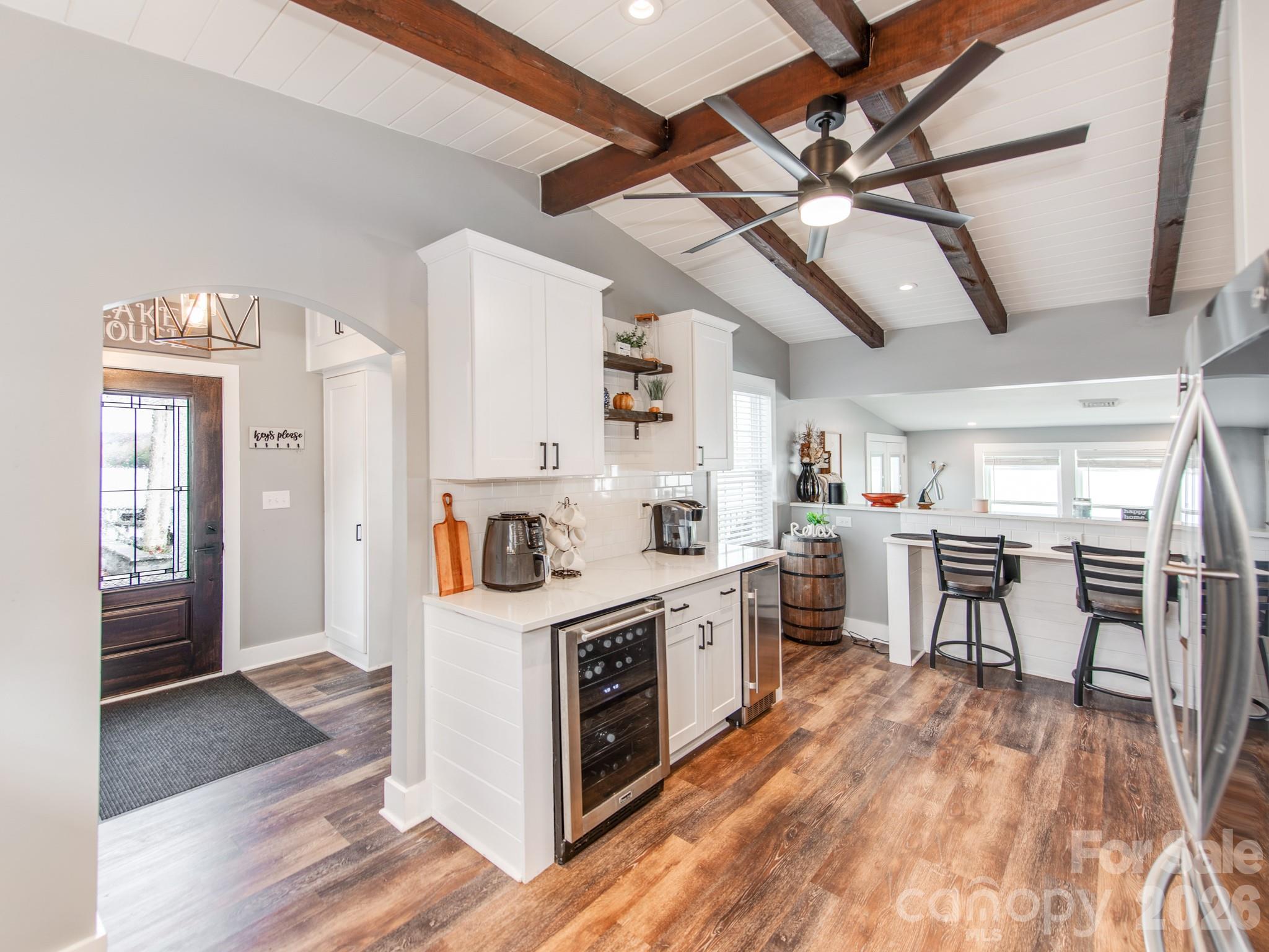 6788 Bucleigh Road Lake Wylie, SC 29710 - Photo 6 of 45 a kitchen that has a lot of cabinets in it and wooden floors