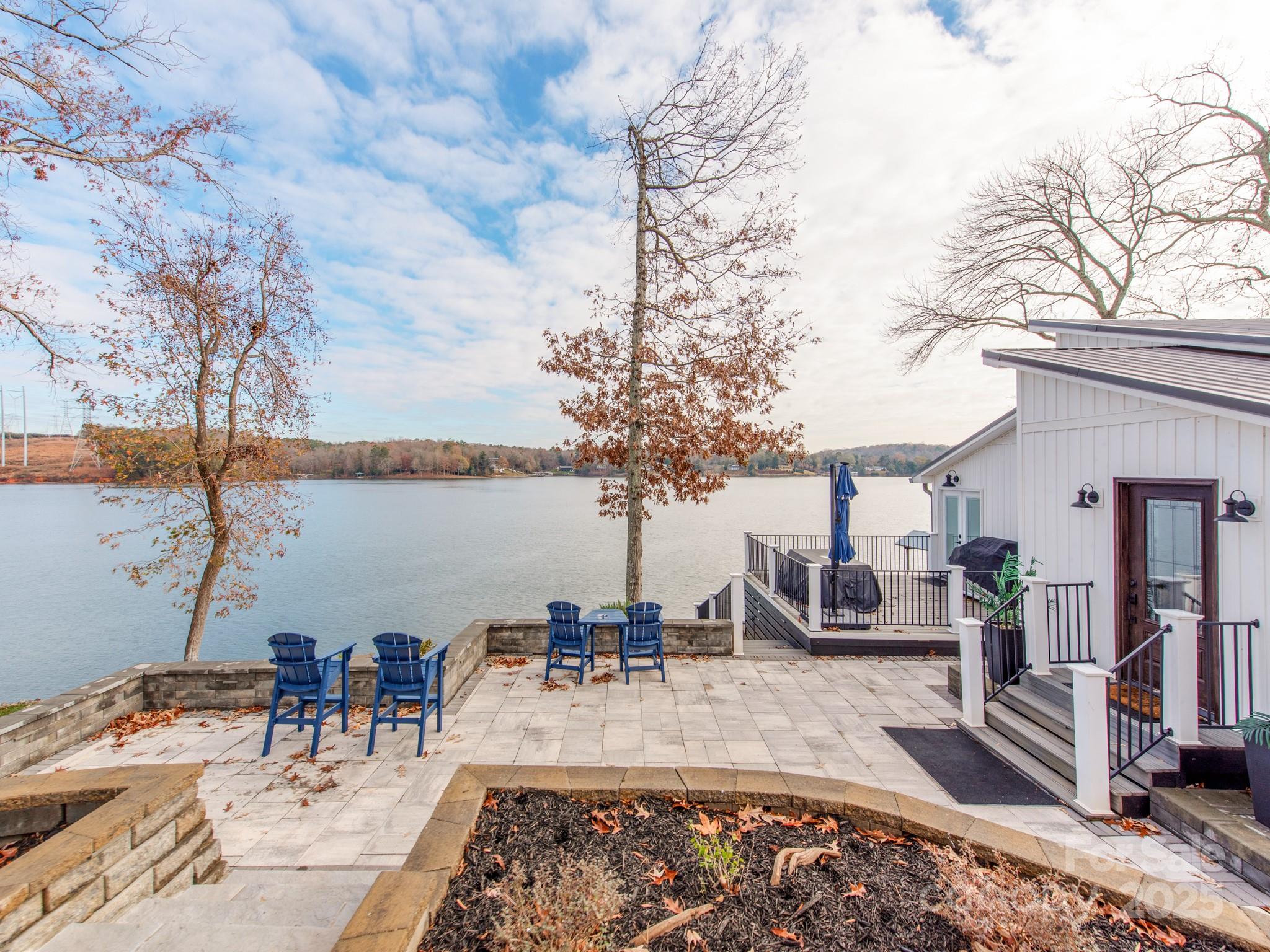 6788 Bucleigh Road Lake Wylie, SC 29710 - Photo 10 of 45 a view of a swimming pool with an outdoor seating