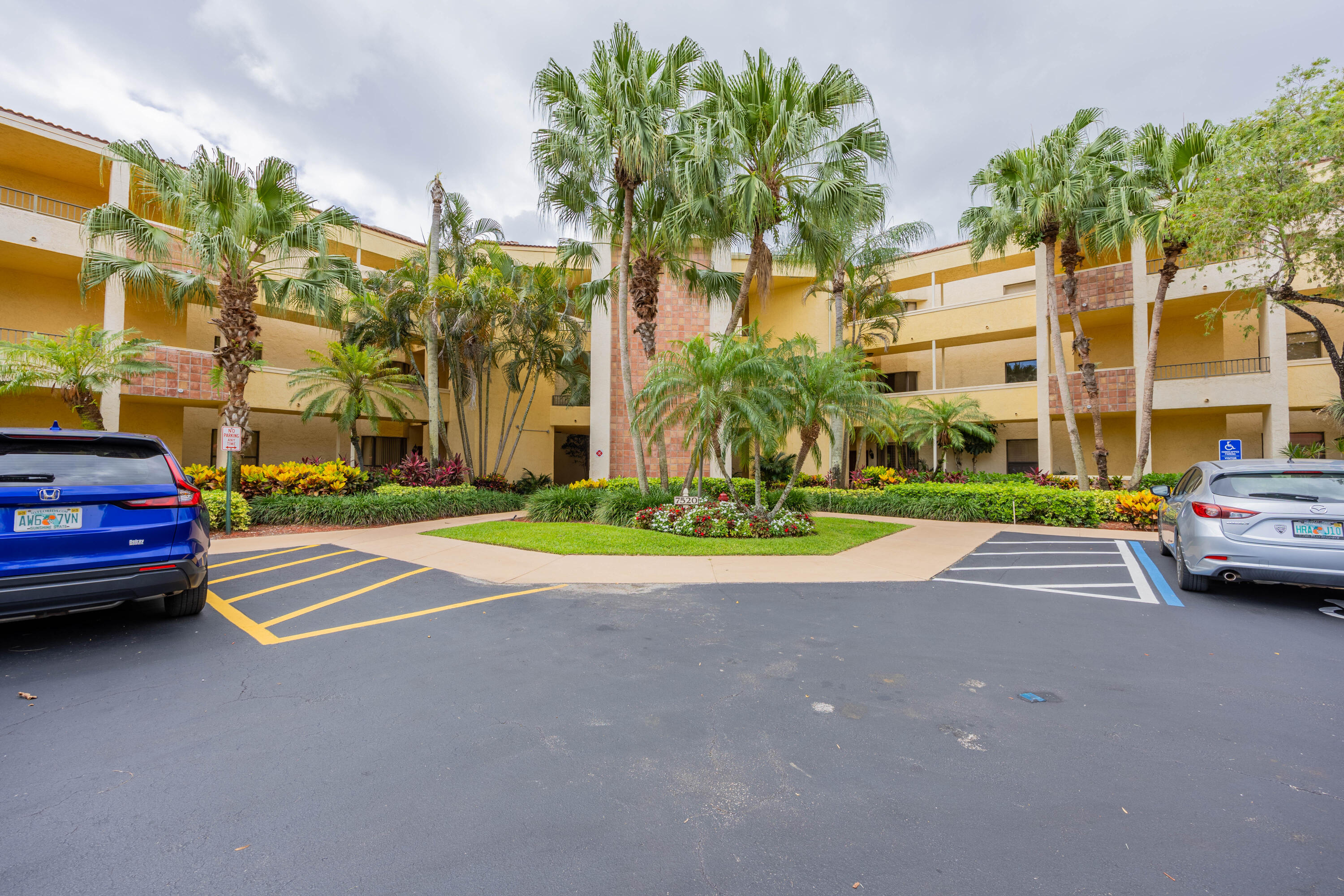 7520 La Paz Boulevard, Unit 104 Boca Raton, FL 33433 - Photo 9 of 56 a view of street with parked cars