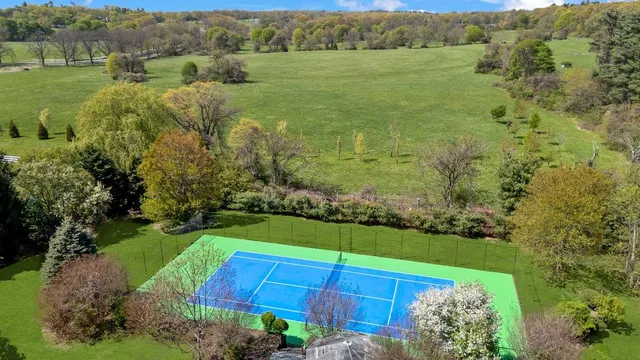 an aerial view of a houses with outdoor space and street view