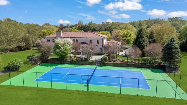 a view of yard with swimming pool and green space