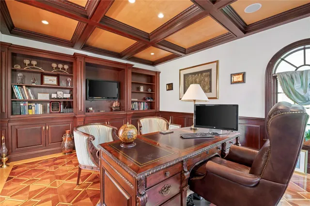 a workspace with furniture and chandelier