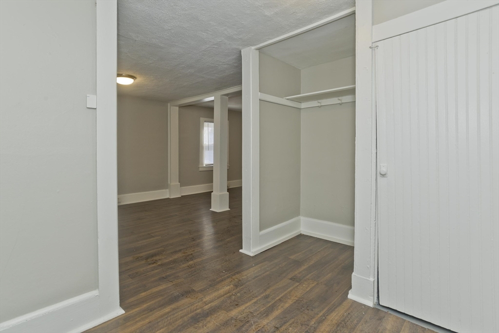 98 Ellsworth Avenue Springfield, MA 01118 - Photo 12 of 17 a view of a hallway with wooden floor