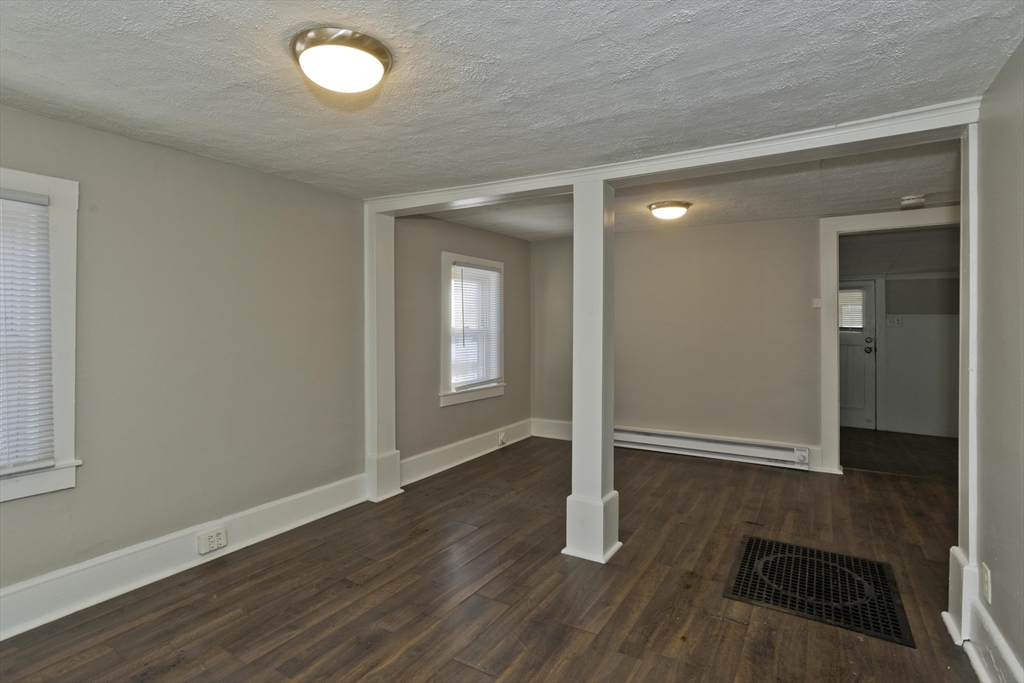 98 Ellsworth Avenue Springfield, MA 01118 - Photo 3 of 17 an empty room with wooden floor and closet