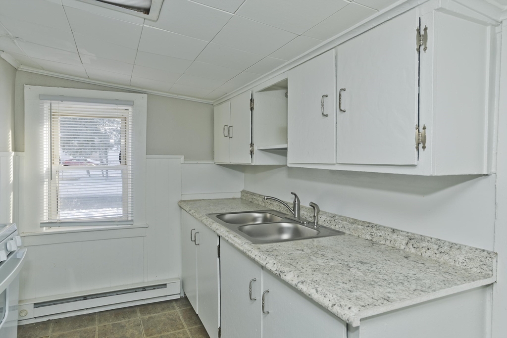 98 Ellsworth Avenue Springfield, MA 01118 - Photo 9 of 17 a kitchen with a sink and cabinets