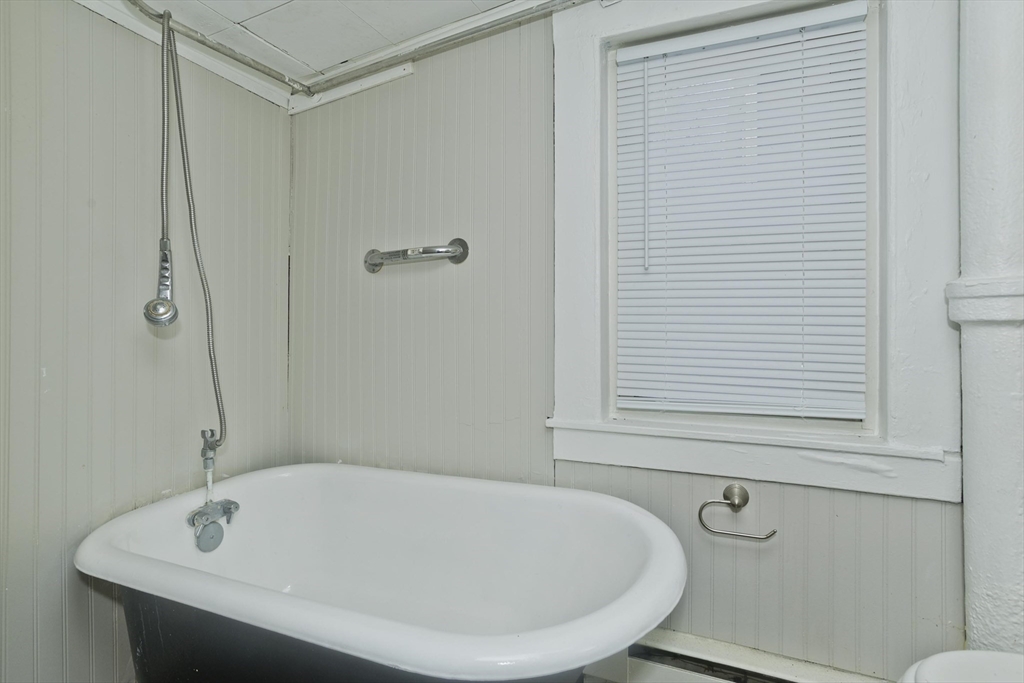 98 Ellsworth Avenue Springfield, MA 01118 - Photo 10 of 17 a white bath tub sitting next to a white sink