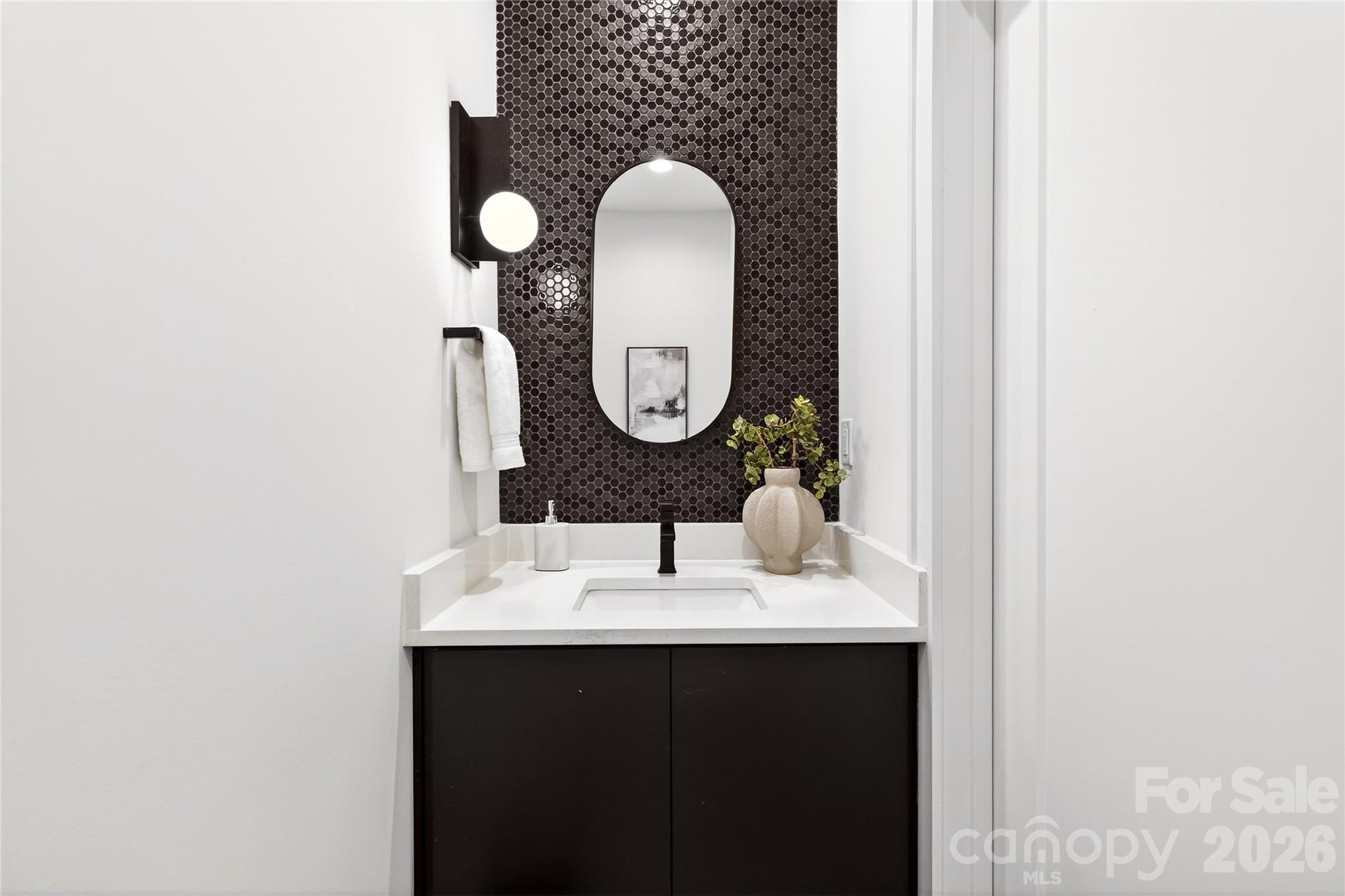 2713 Ruby Street Charlotte, NC 28208 - Photo 16 of 31 a bathroom with a sink and a mirror