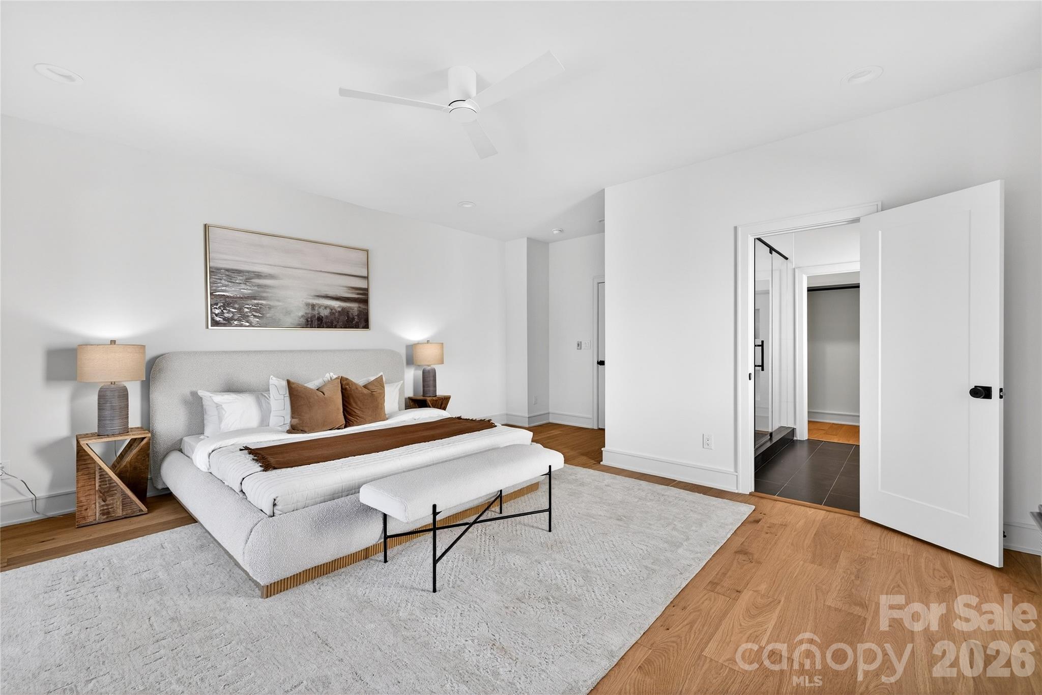 2713 Ruby Street Charlotte, NC 28208 - Photo 18 of 31 a spacious bedroom with a bed and a lamp