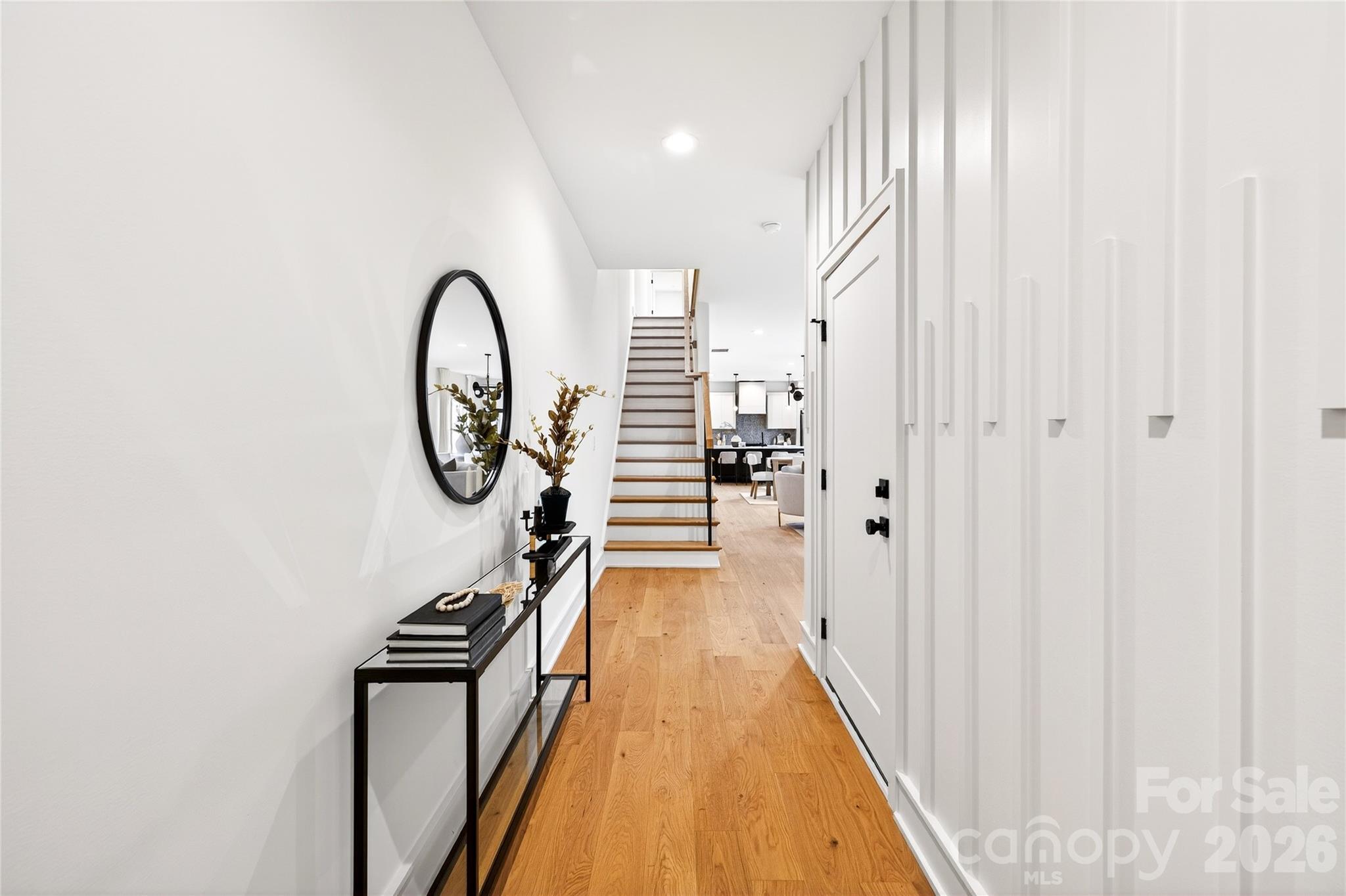 2713 Ruby Street Charlotte, NC 28208 - Photo 2 of 31 a view of a hallway with wooden floor and staircase