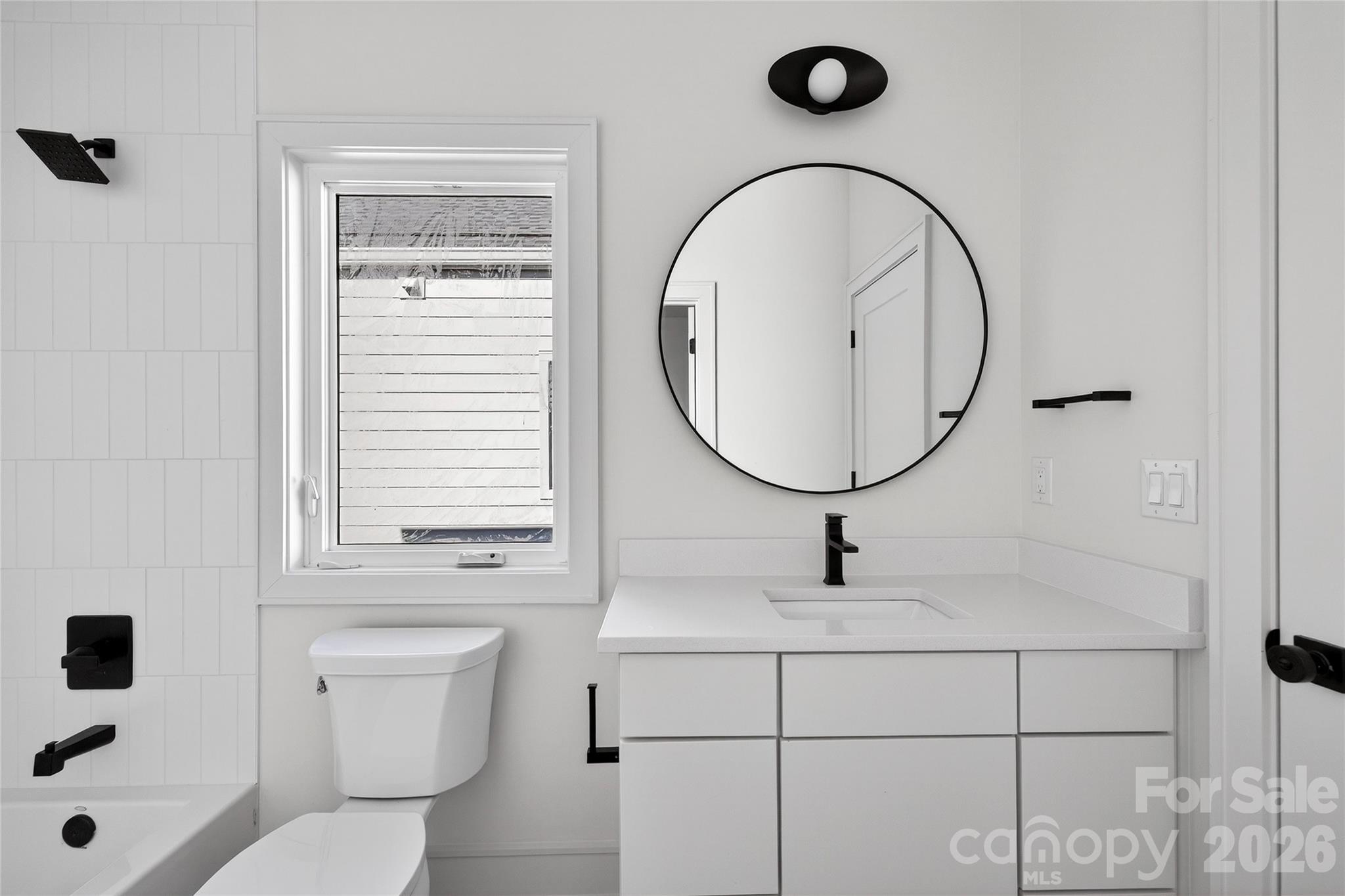 2713 Ruby Street Charlotte, NC 28208 - Photo 28 of 31 a bathroom with a sink a toilet and a mirror