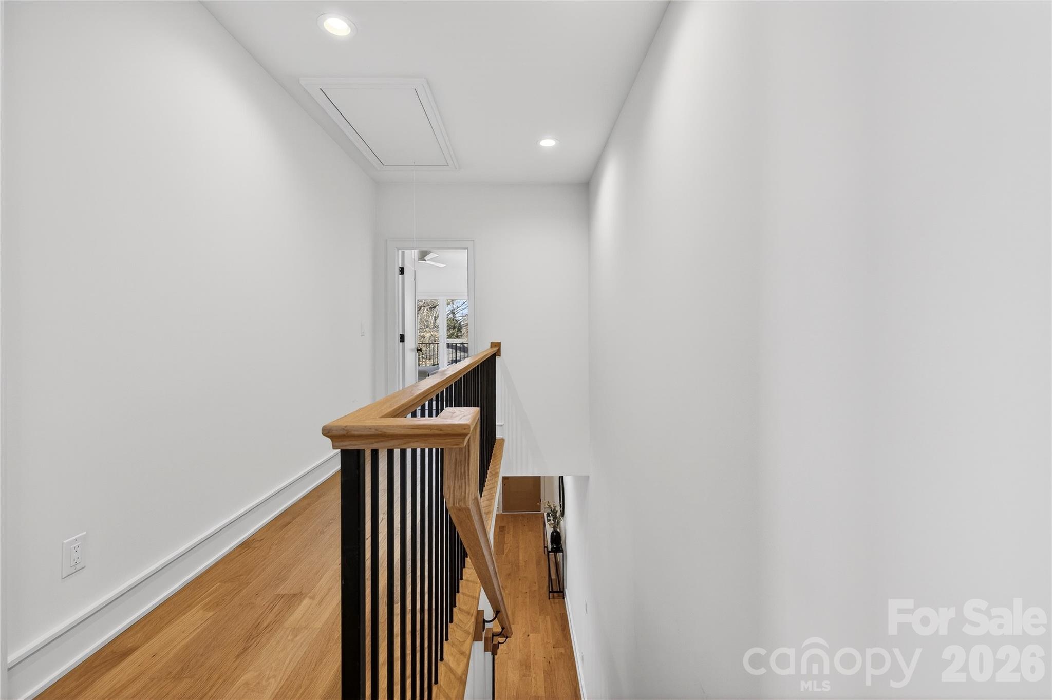 2713 Ruby Street Charlotte, NC 28208 - Photo 30 of 31 a view of a hallway with wooden floor and staircase