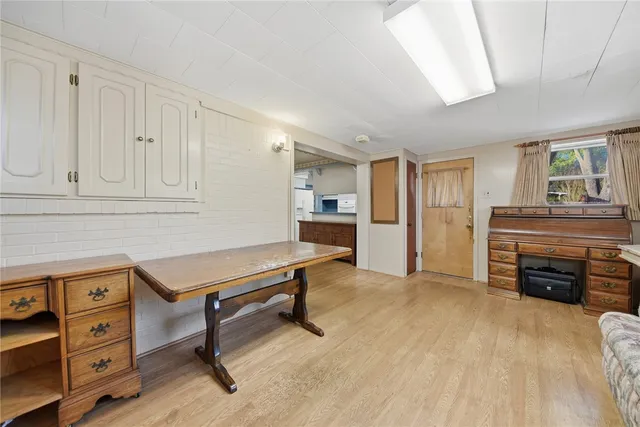 a living room with furniture and a kitchen