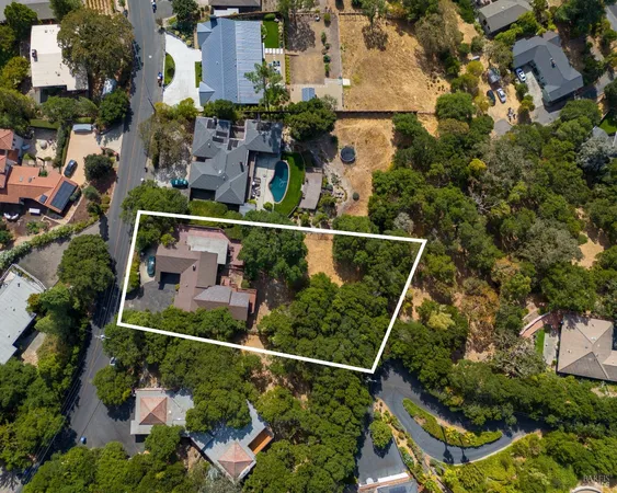 an aerial view of multiple houses with outdoor space