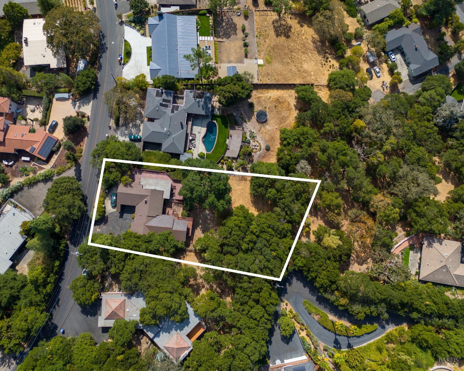 an aerial view of multiple houses with outdoor space