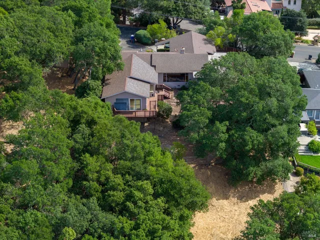 an aerial view of house with yard
