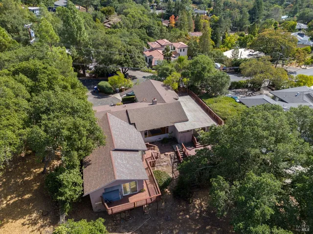 an aerial view of a house with yard swimming pool and outdoor seating