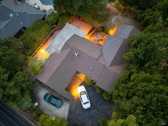 an aerial view of house with yard swimming pool and outdoor seating