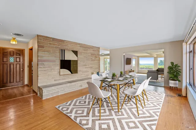 a view of a livingroom with furniture and wooden floor