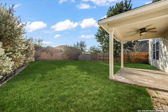 a view of an house with backyard space and garden