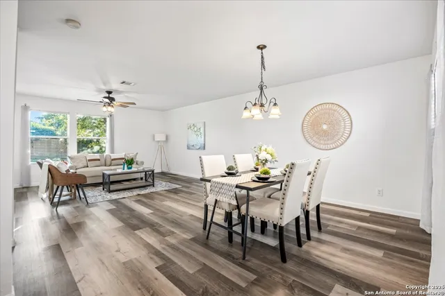 a view of a dining room with furniture window and wooden floor