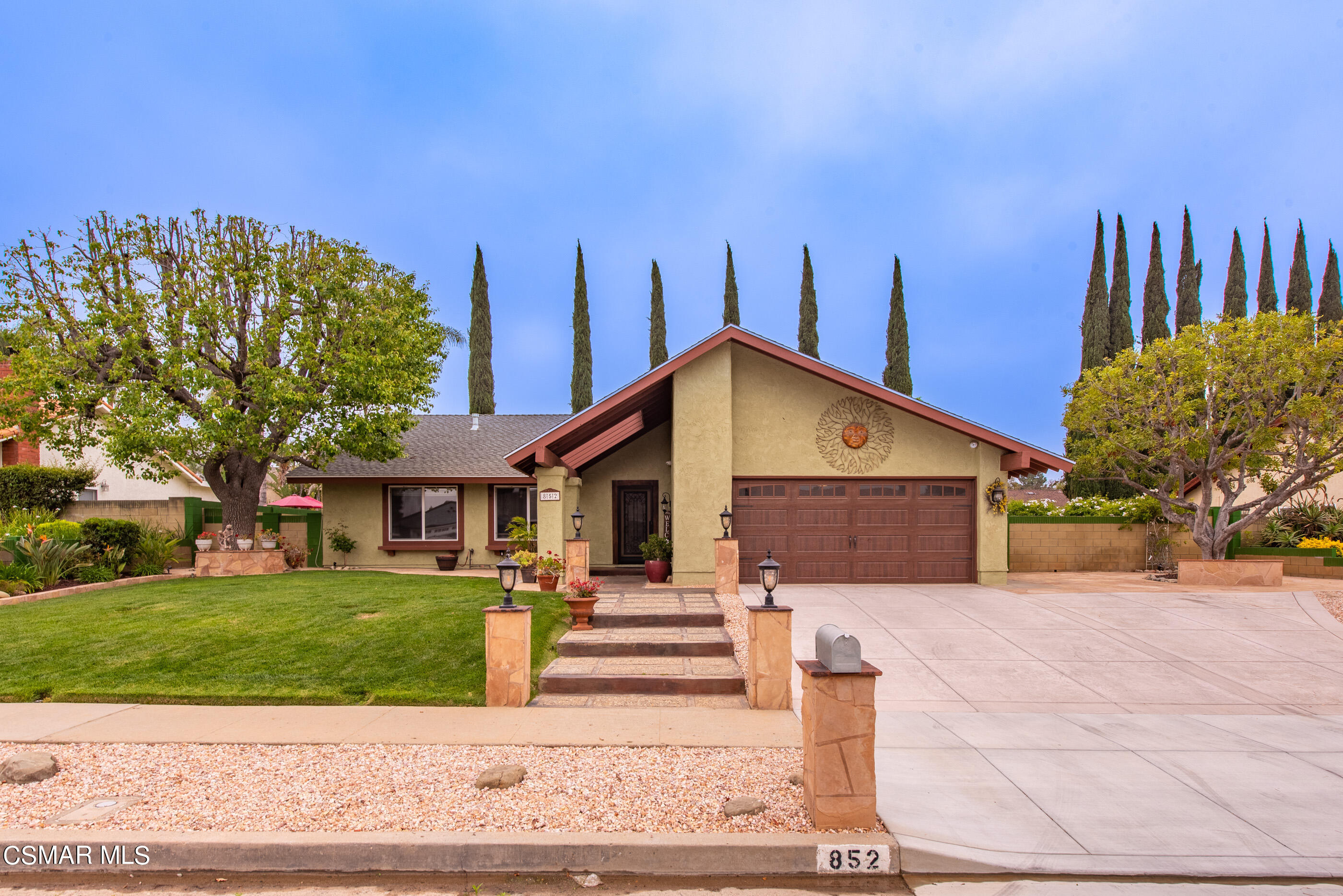 a front view of a house with garden