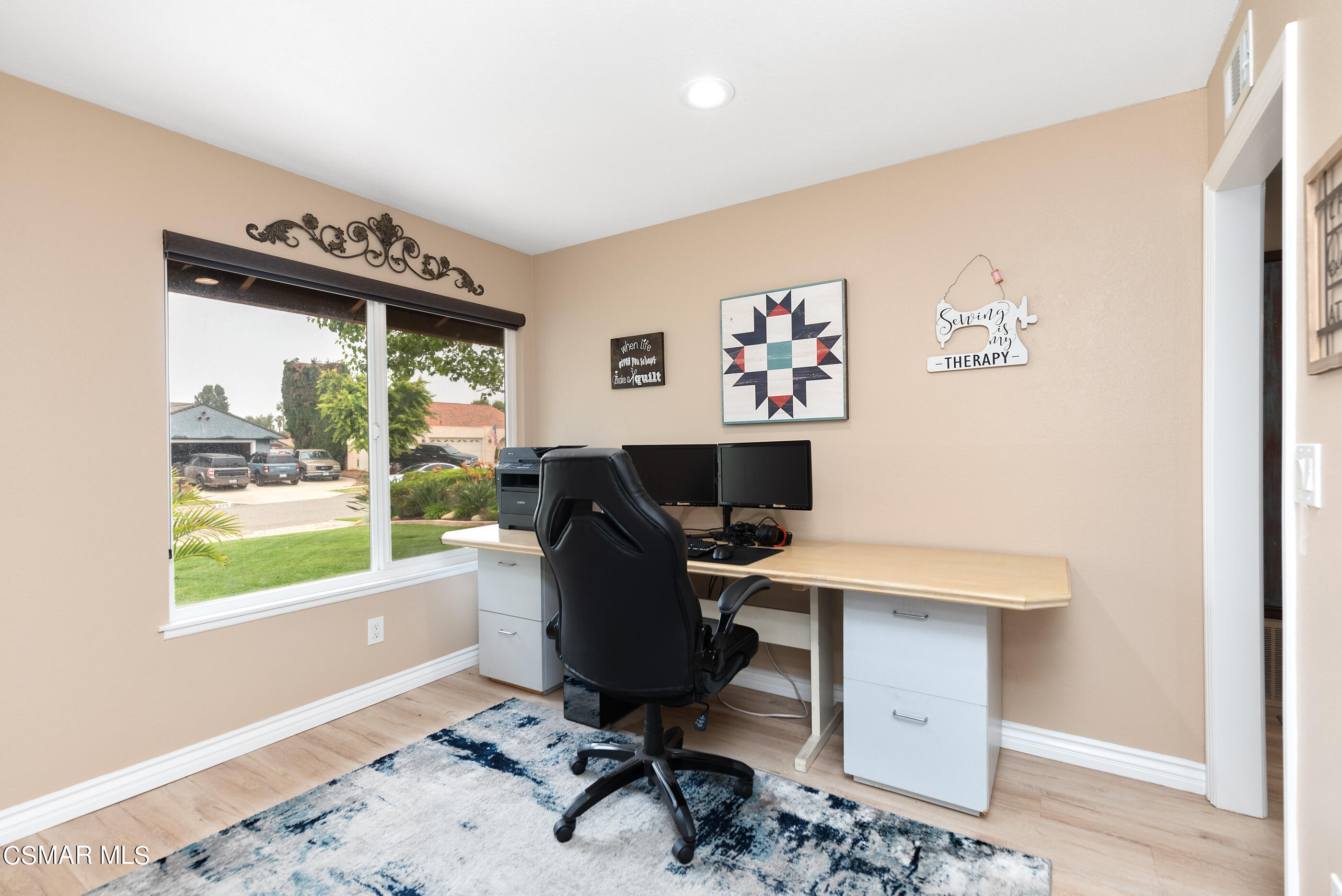 852 Weaver Street Simi Valley, CA 93065 - Photo 14 of 45 a view of a workspace with furniture and a window