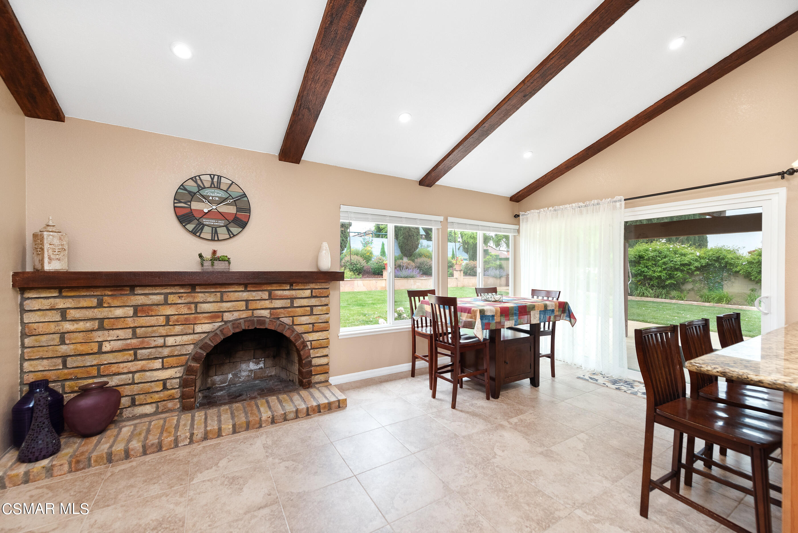 852 Weaver Street Simi Valley, CA 93065 - Photo 16 of 45 a living room with furniture a fireplace and a floor to ceiling window