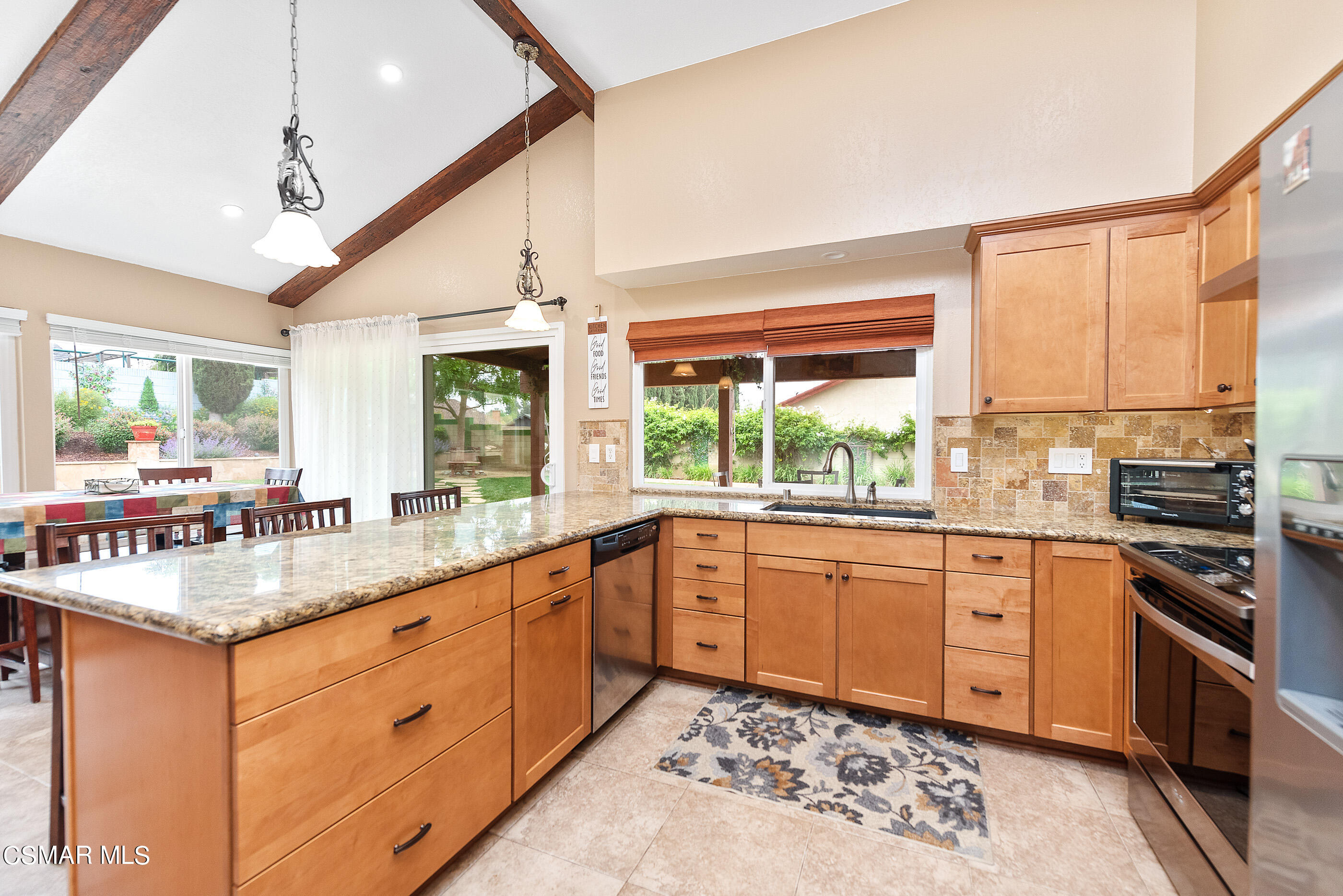 852 Weaver Street Simi Valley, CA 93065 - Photo 20 of 45 a kitchen with stainless steel appliances granite countertop sink stove and refrigerator