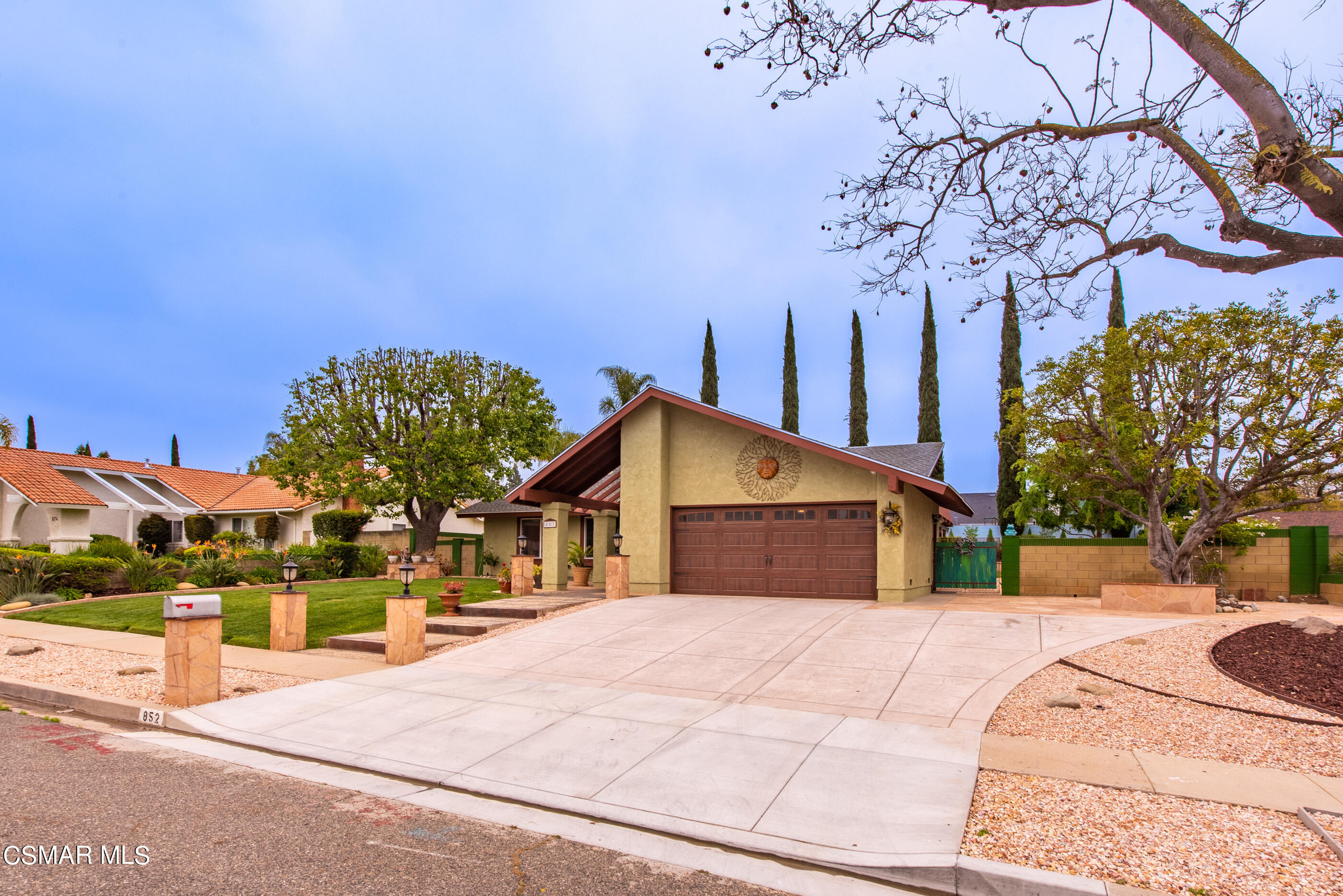 852 Weaver Street Simi Valley, CA 93065 - Photo 2 of 45 a view of a white house with a yard and potted plants