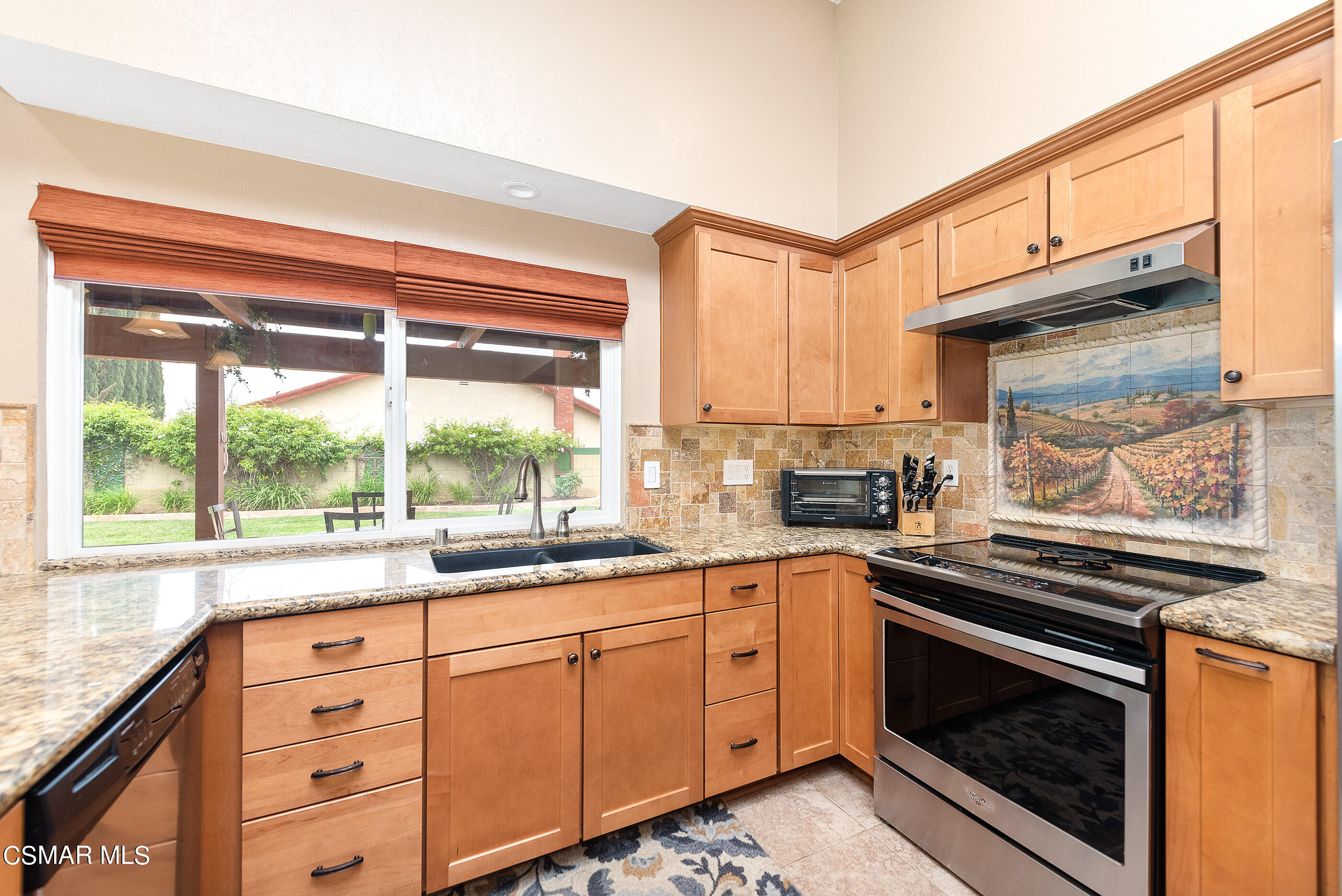 852 Weaver Street Simi Valley, CA 93065 - Photo 21 of 45 a kitchen with granite countertop stainless steel appliances white cabinets and a window