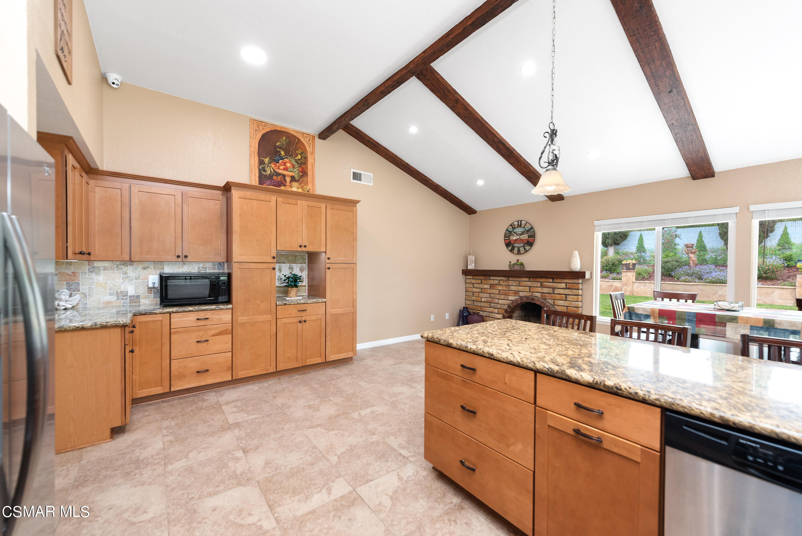 852 Weaver Street Simi Valley, CA 93065 - Photo 22 of 45 a kitchen with granite countertop a sink a counter space appliances and cabinets