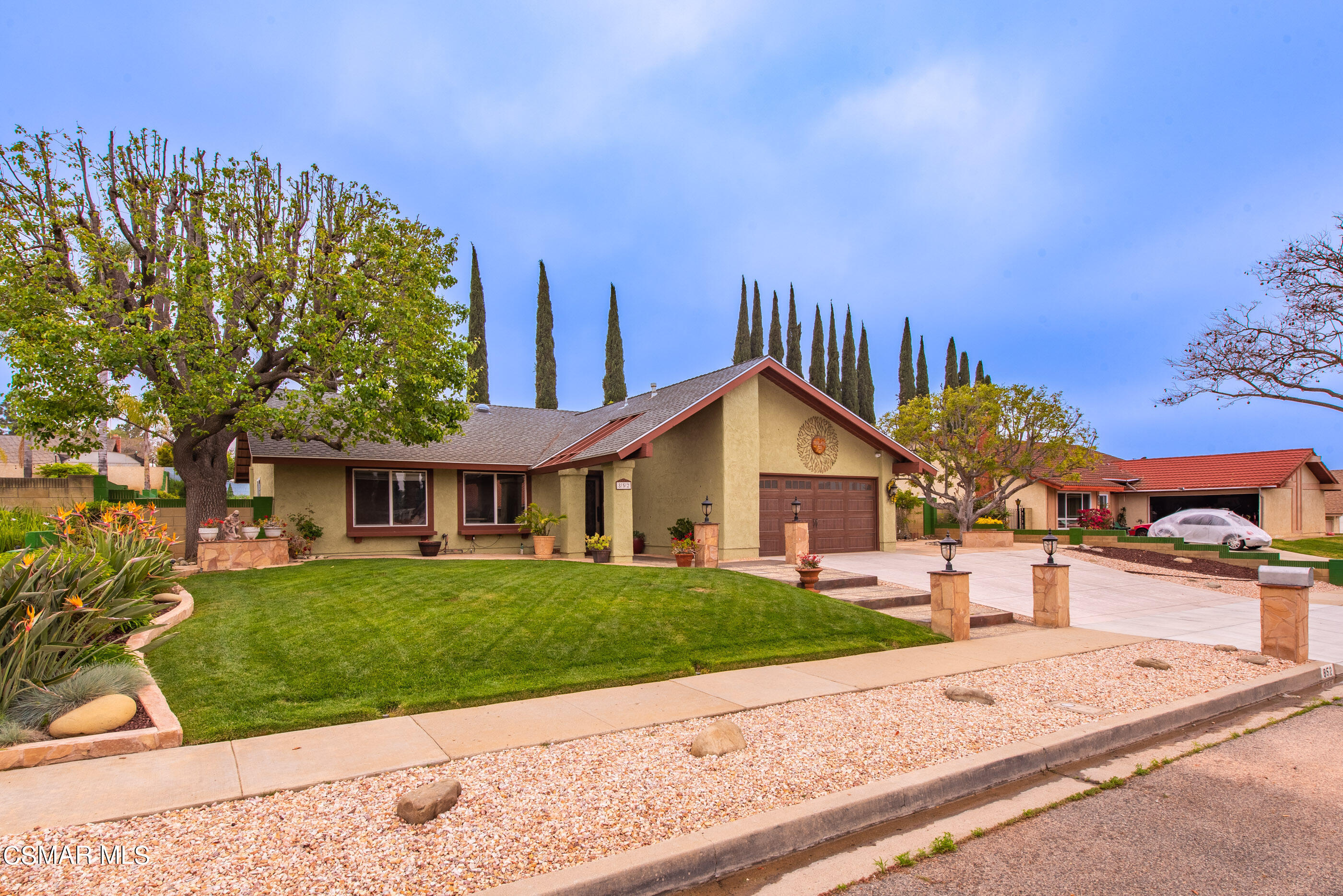 852 Weaver Street Simi Valley, CA 93065 - Photo 3 of 45 a front view of a house with a yard and garage