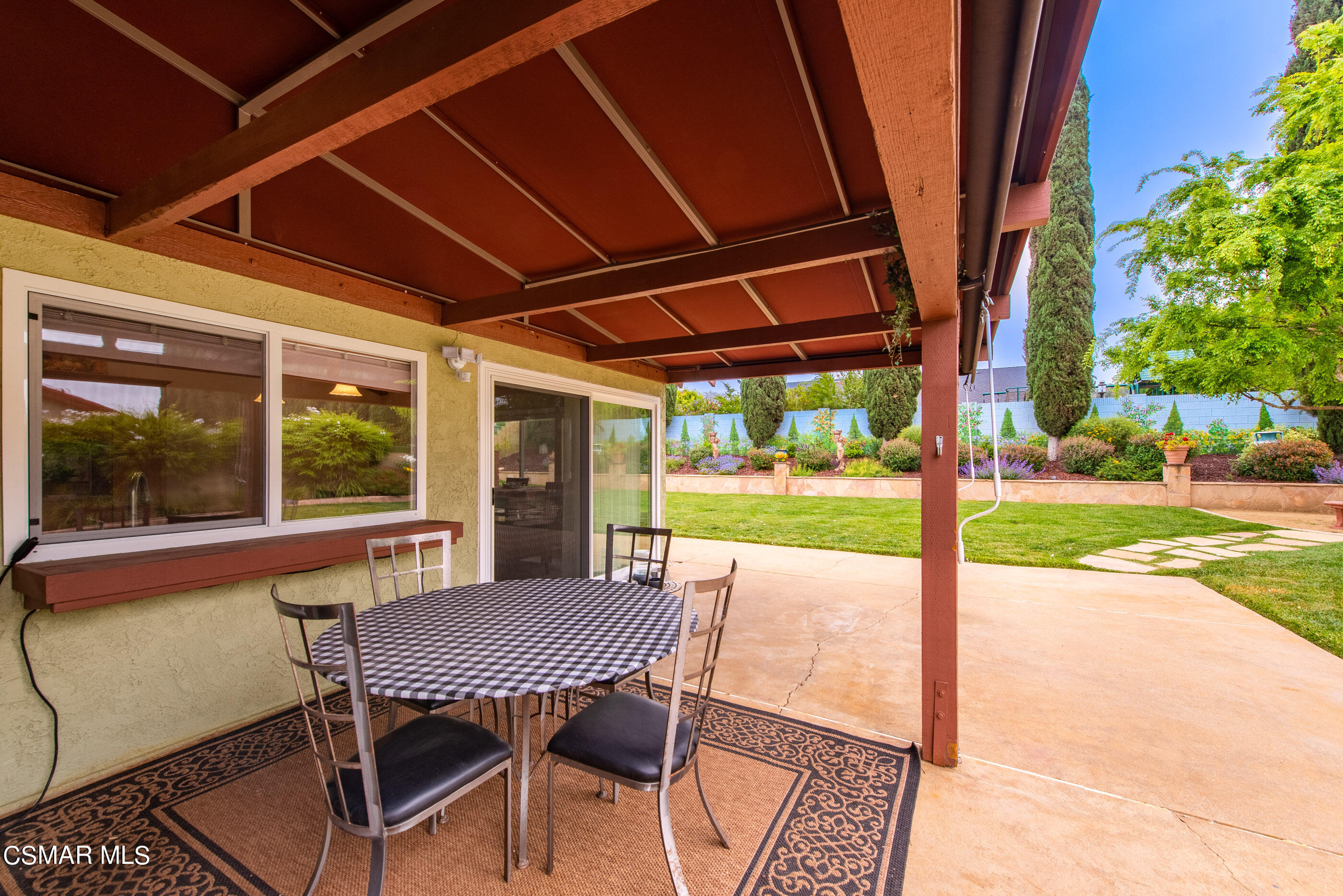 852 Weaver Street Simi Valley, CA 93065 - Photo 37 of 45 a view of a patio with a table chairs and a backyard