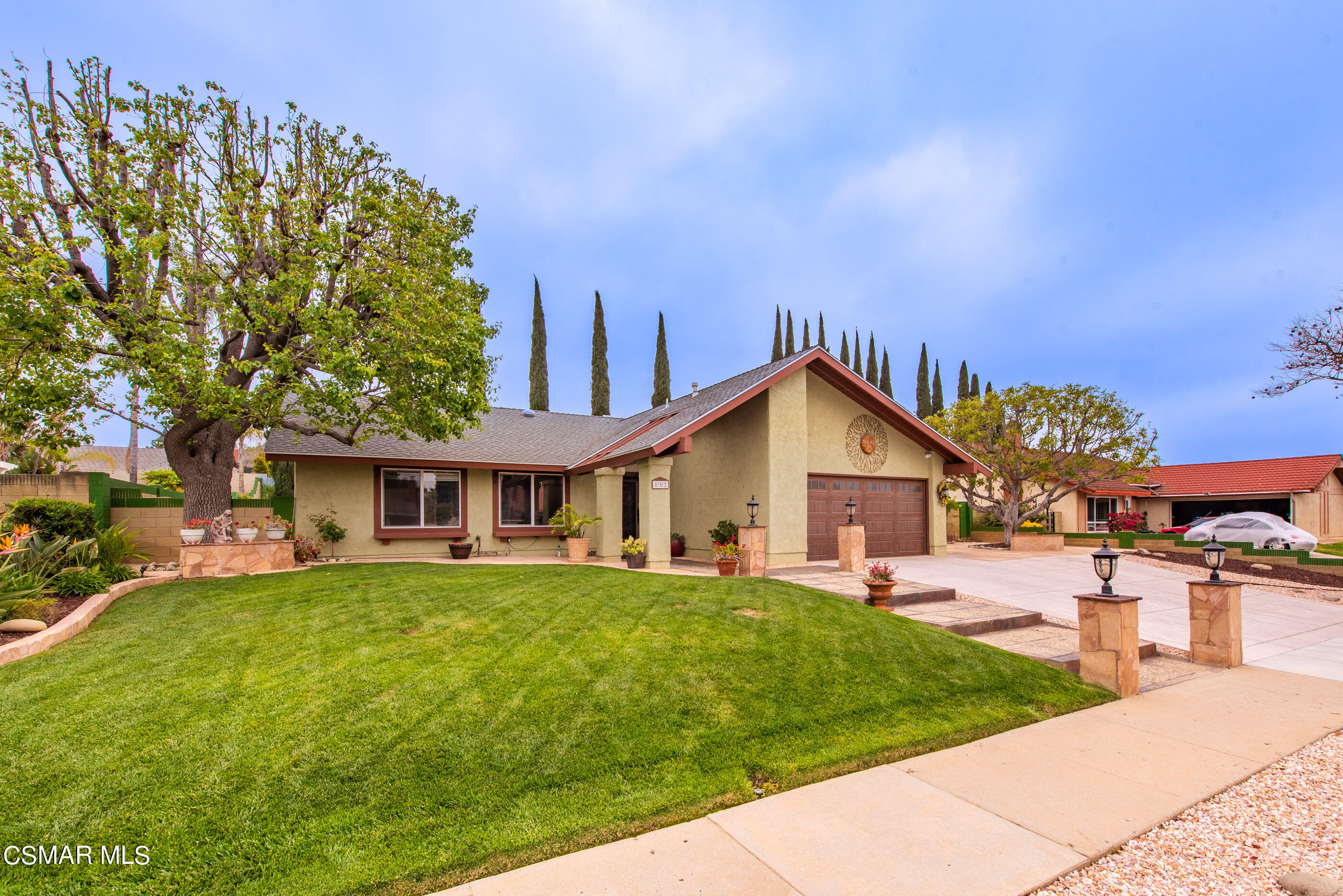 852 Weaver Street Simi Valley, CA 93065 - Photo 4 of 45 a front view of a house with a yard and trees
