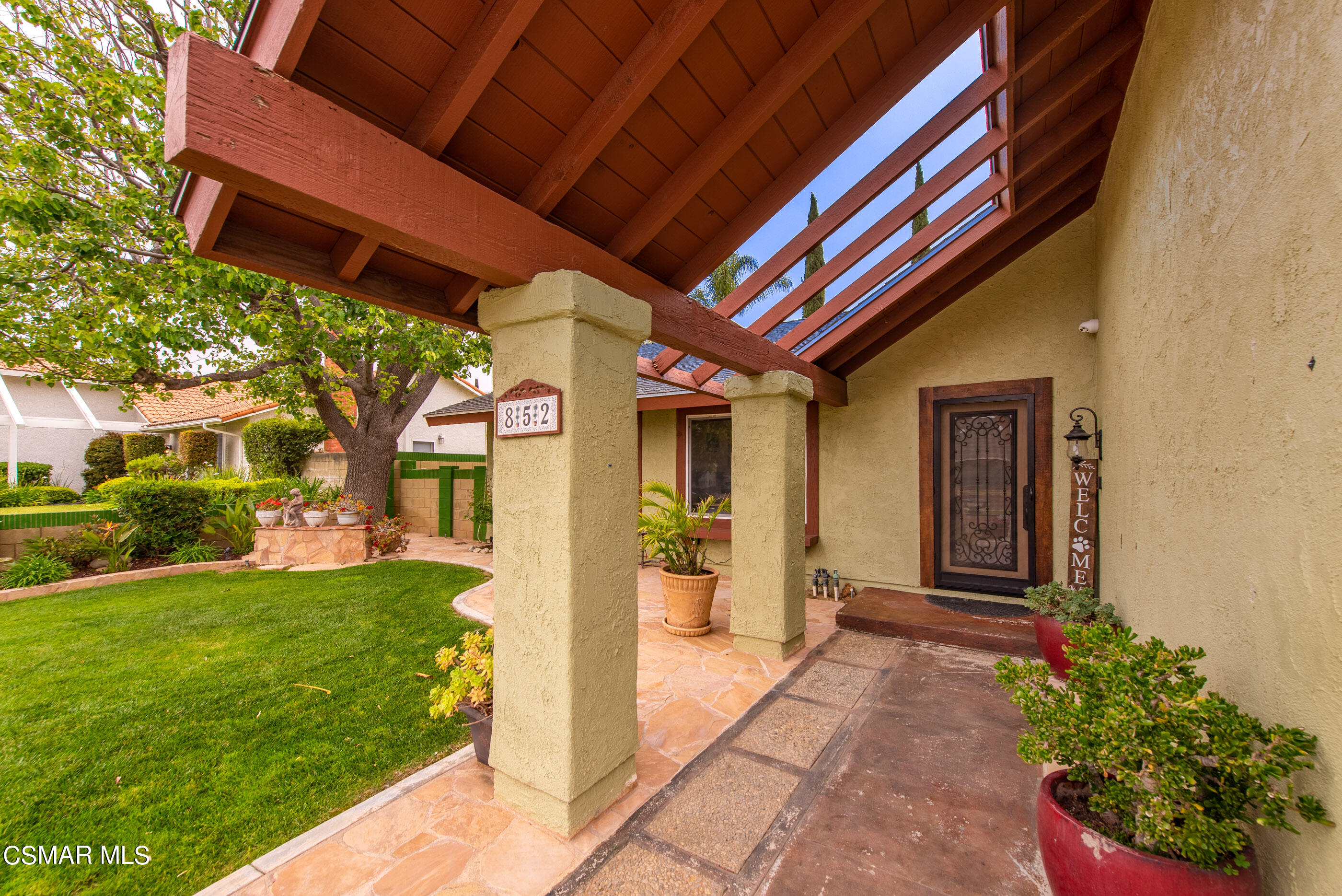 852 Weaver Street Simi Valley, CA 93065 - Photo 5 of 45 a front view of a house with a garden
