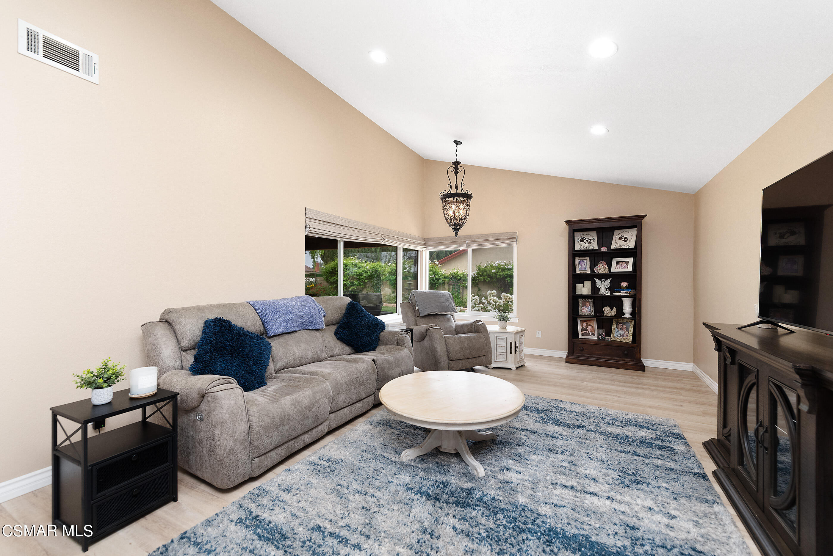 852 Weaver Street Simi Valley, CA 93065 - Photo 10 of 45 a living room with furniture a rug and a flat screen tv