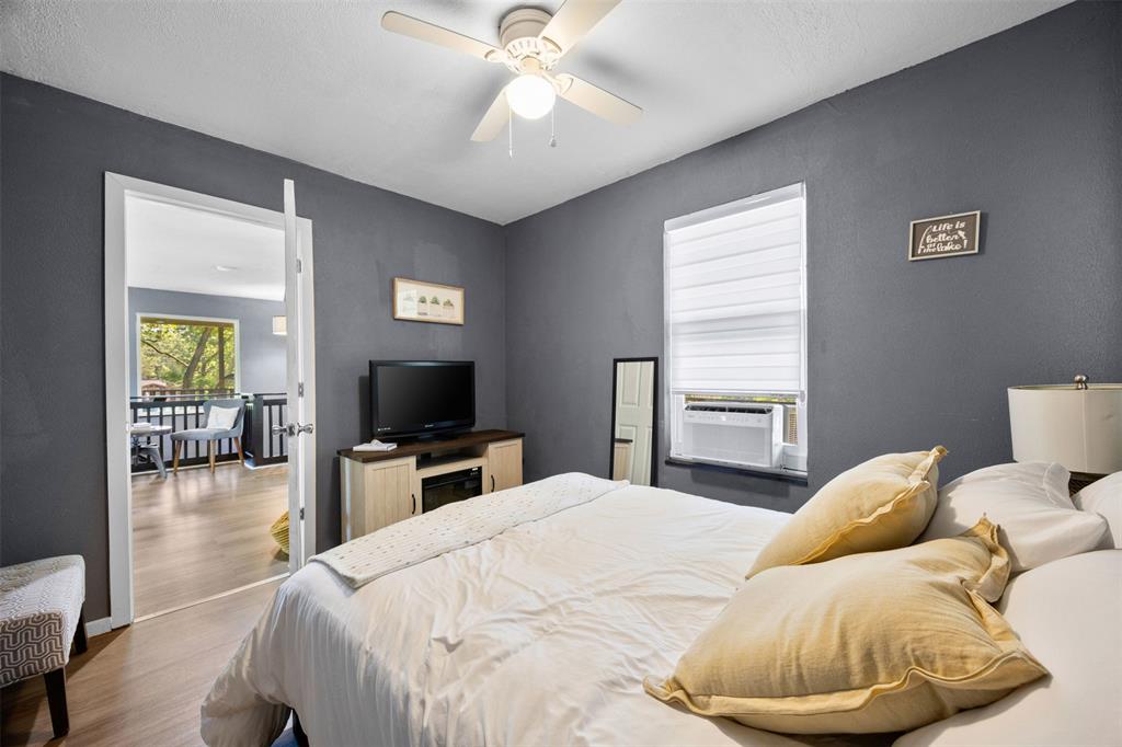 7110 Apache Circle Mabank, TX 75156 - Photo 23 of 40 a bedroom with a bed and a television