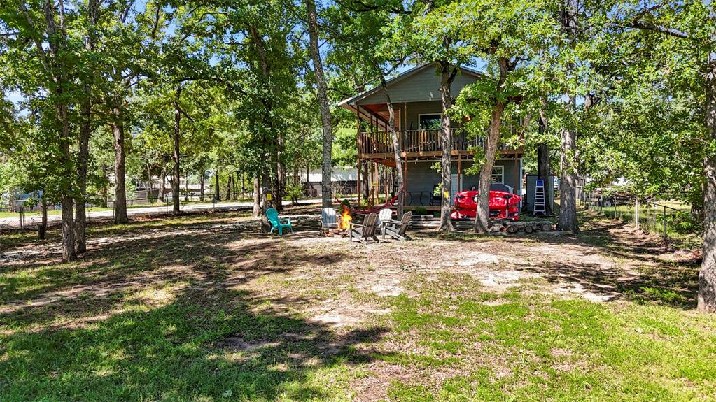 7110 Apache Circle Mabank, TX 75156 - Photo 4 of 40 a view of outdoor space with deck and trees