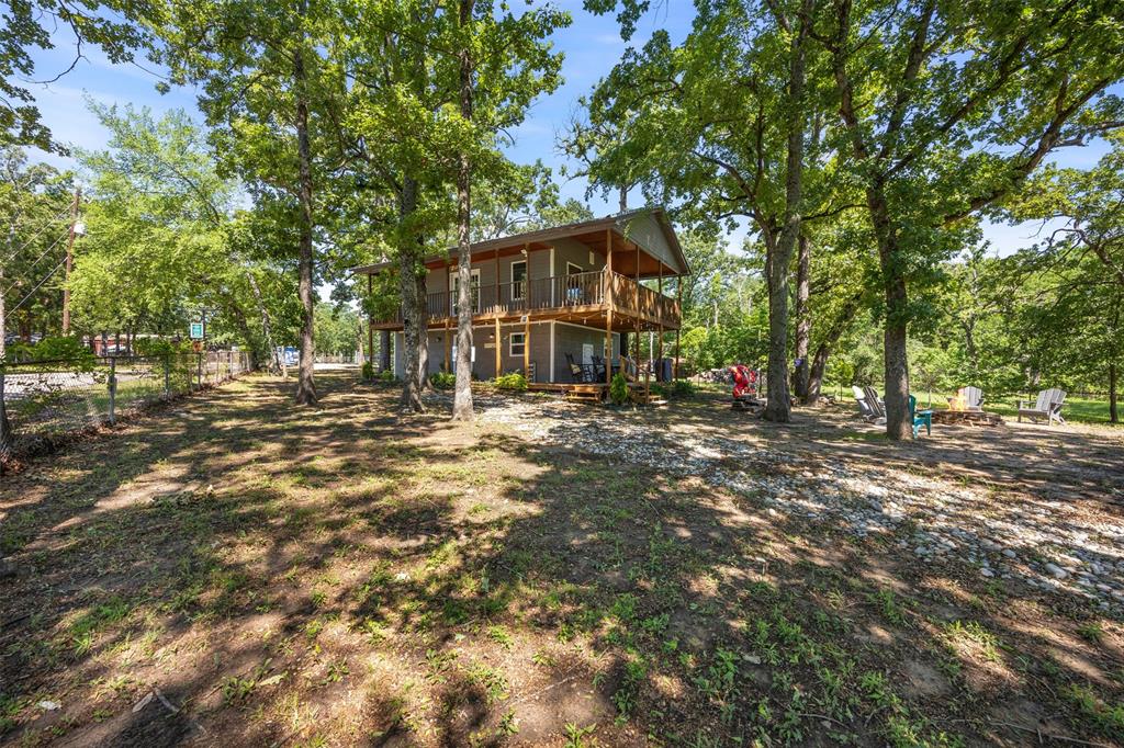 7110 Apache Circle Mabank, TX 75156 - Photo 5 of 40 a view of a house with a large tree