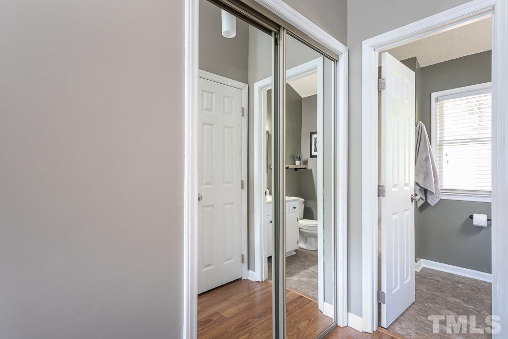 3306 Mill Run, Unit 3306 Raleigh, NC 27612 - Photo 20 of 24 a view of a bathroom from a hallway