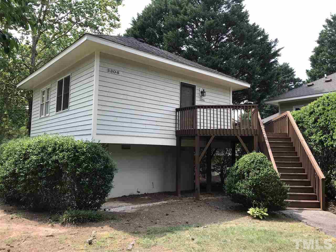 3306 Mill Run, Unit 3306 Raleigh, NC 27612 - Photo 3 of 24 a front view of a house with garden